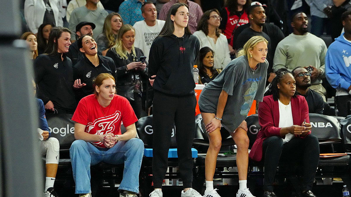 Indiana Fever forward Chloe Bibby (55), Indiana Fever guard Caitlin Clark (22), and Indiana Fever guard Sophie Cunningham (8) react from the bench near the end of overtime against the Las Vegas Aces during game five of the second round for the 2025 WNBA Playoffs at Michelob Ultra Arena.