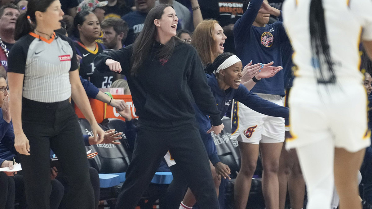 Injured Indiana Fever guard Caitlin Clark cheers after a basket against the Phoenix Mercury during the first quarter at PHX Arena on Sept. 2, 2025.