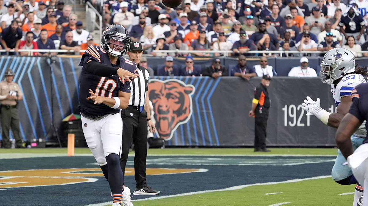 Chicago Bears quarterback Caleb Williams (18) drops back to pass against the Dallas Cowboys during the first half at Soldier Field. 