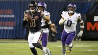 Chicago Bears quarterback Caleb Williams (18) rushes the ball against the Minnesota Vikings during the second half at Soldier Field.