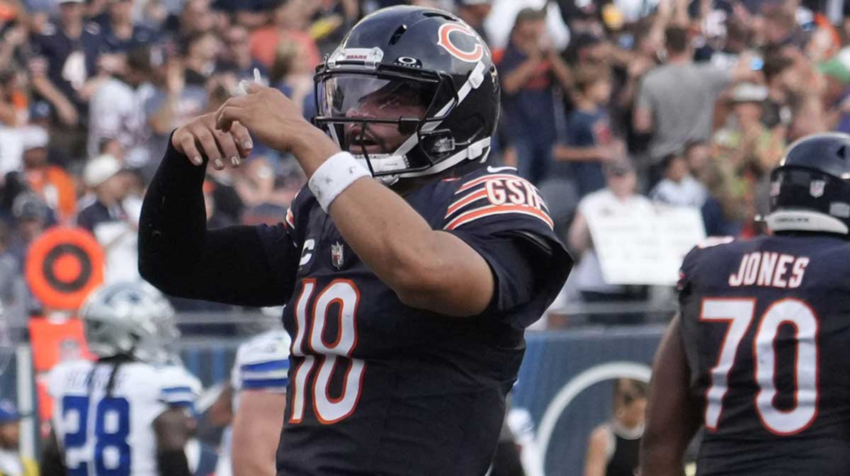 Chicago Bears quarterback Caleb Williams (18) gestures after throwing a touchdown against the Dallas Cowboys during the second half at Soldier Field.