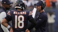 Chicago Bears head coach Ben Johnson talks with quarterback Caleb Williams (18) against the Dallas Cowboys during the second half at Soldier Field.