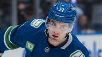 Vancouver Canucks forward Nils Hoglander (21) skates during warm up prior to a game against the Winnipeg Jets at Rogers Arena.