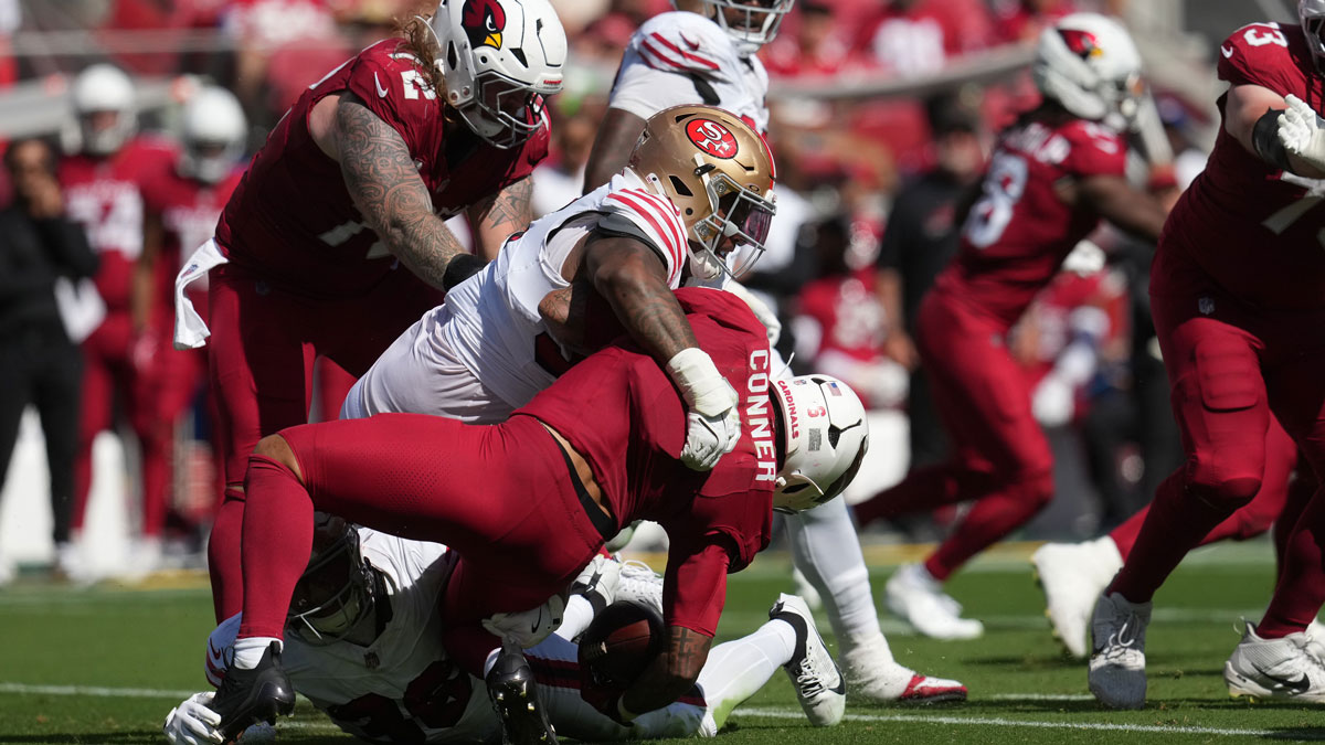 Arizona Cardinals running back James Conner (6) is tackled by the San Francisco 49ers during the second half at Levi's Stadium