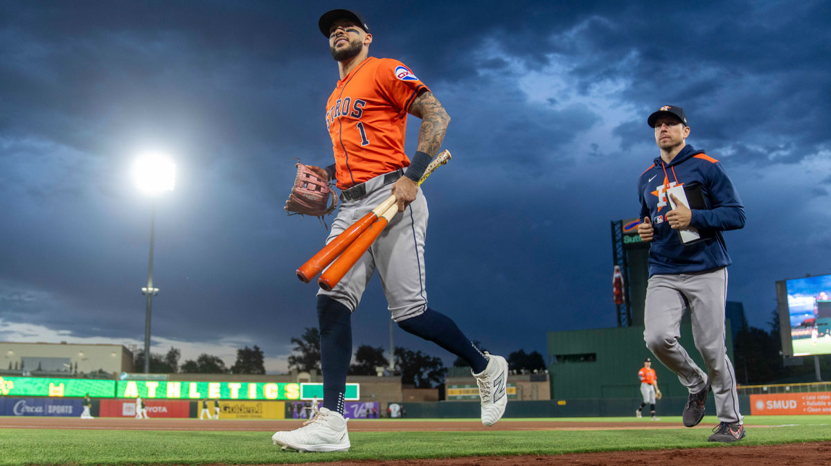 Houston Astros shortstop Carlos Correa (1) jogs towards the dugout before the start of the game against the Athletics at Sutter Health Park.