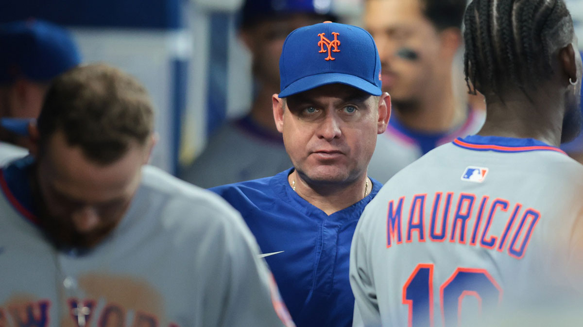 New York Mets manager Carlos Mendoza (64) looks on against the Miami Marlins during the eighth inning at loanDepot Park.