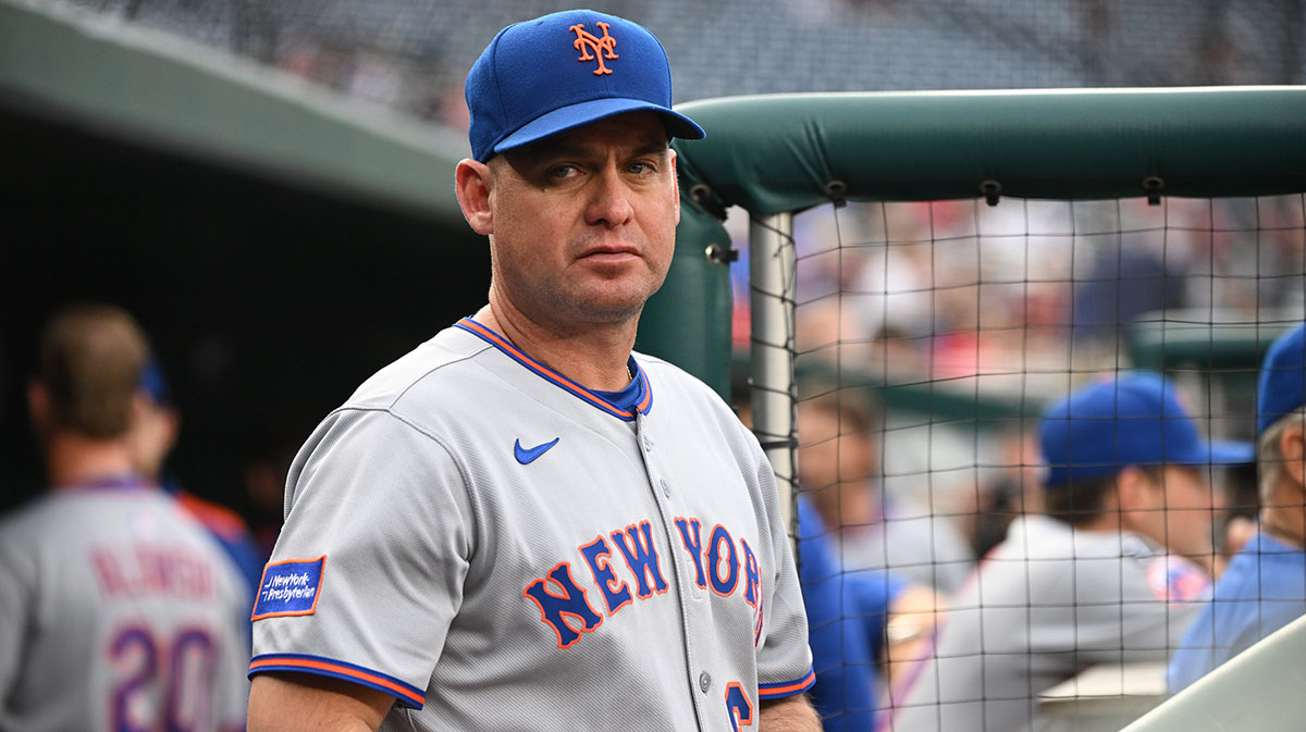 New York Mets manager Carlos Mendoza (64) stands in the dugout before a game against the Washington Nationals at Nationals Park.