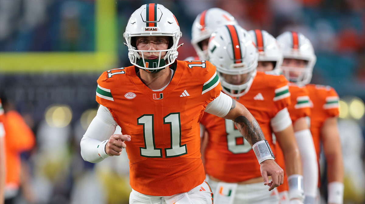 Miami Hurricanes quarterback Carson Beck (11) practices before the game against the Notre Dame Fighting Irish at Hard Rock Stadium.