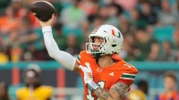 Miami Hurricanes quarterback Carson Beck (11) passes the football against the Bethune-Cookman Wildcats during the first quarter at Hard Rock Stadium.