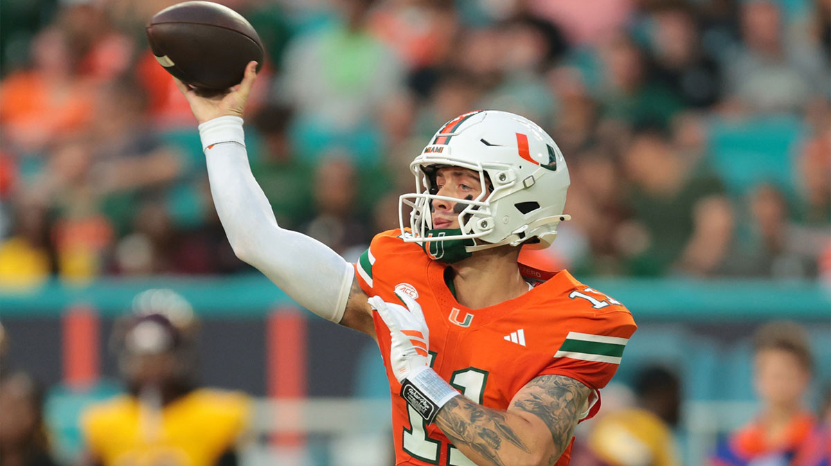 Miami Hurricanes quarterback Carson Beck (11) passes the football against the Bethune-Cookman Wildcats during the first quarter at Hard Rock Stadium.