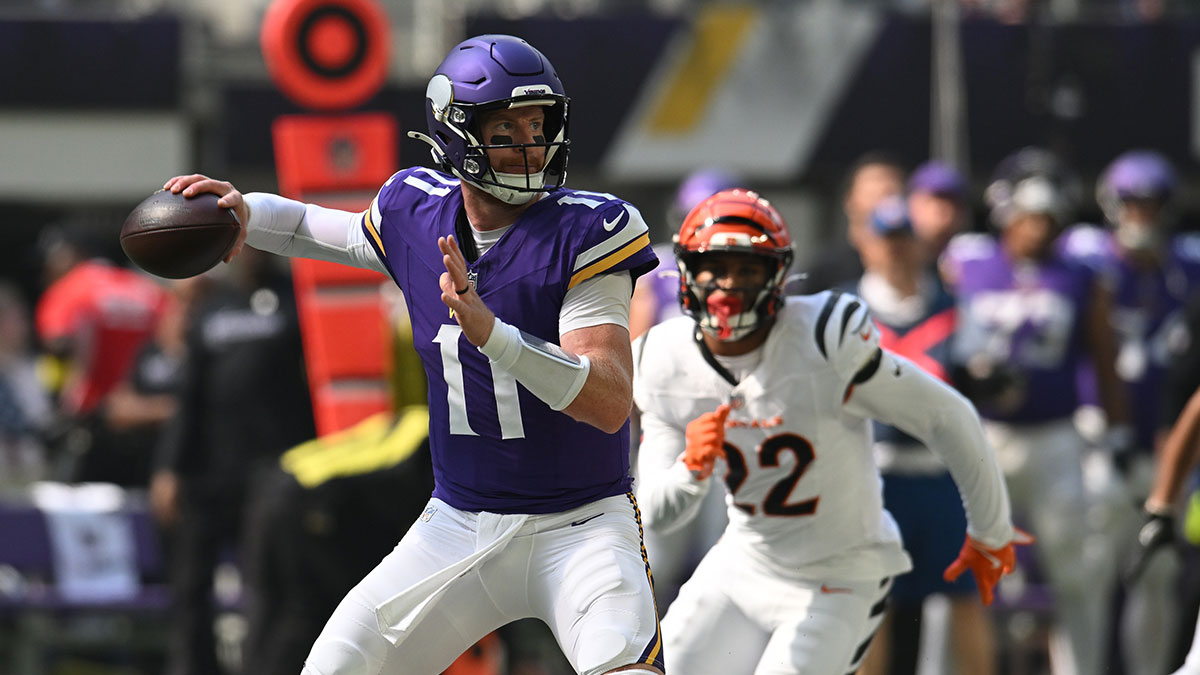 Minnesota Vikings quarterback Carson Wentz (11) throws downfield against the Cincinnati Bengals during the first half at U.S. Bank Stadium.