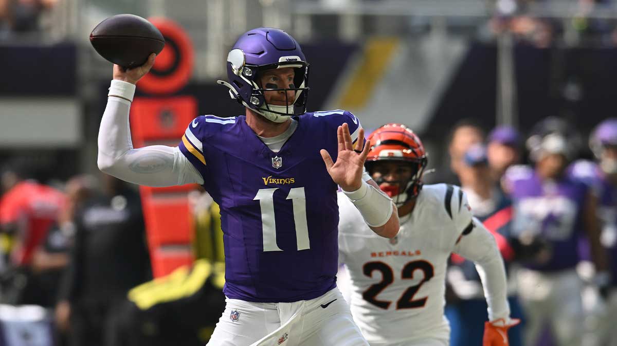 Minnesota Vikings quarterback Carson Wentz (11) throws downfield against the Cincinnati Bengals during the first half at U.S. Bank Stadium.