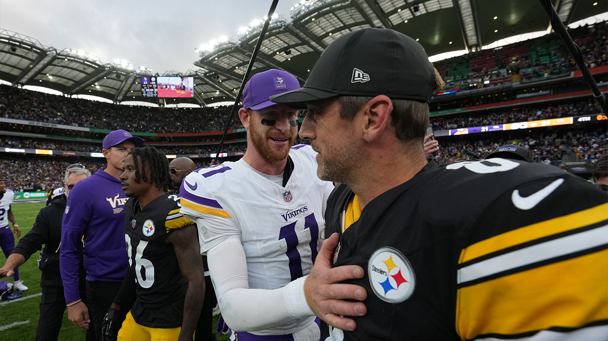 Minnesota Vikings quarterback Carson Wentz (11) and Pittsburgh Steelers quarterback Aaron Rodgers (8) shake hands following a game during an NFL International Series game at Croke Park.