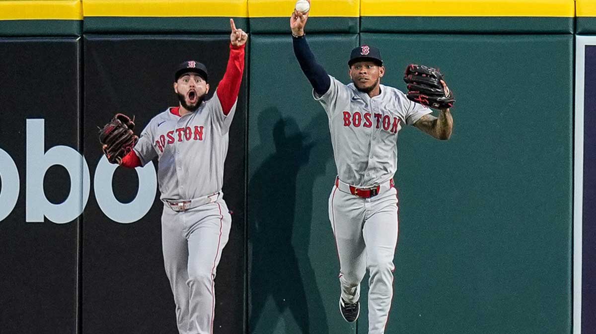 Boston Red Sox center fielder Ceddanne Rafaela (3), right, celebrates catching a fly out against Detroit Tigers designated hitter Kerry Carpenter (30) next to right fielder Rob Refsnyder (30), left, during the seventh inning at Comerica Park in Detroit on Wednesday, May 14, 2025.