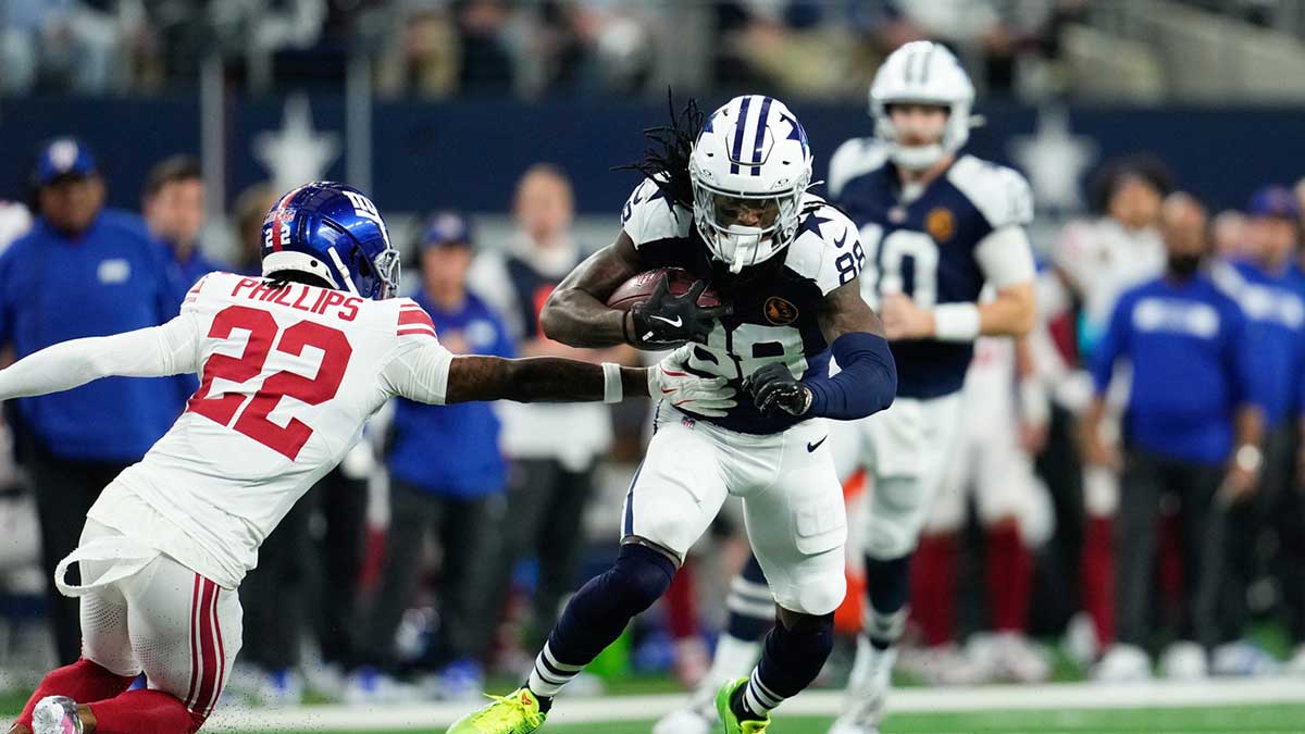 Dallas Cowboys wide receiver CeeDee Lamb (88) catches a pass as New York Giants cornerback Dru Phillips (22) defends during the first half at AT&T Stadium.