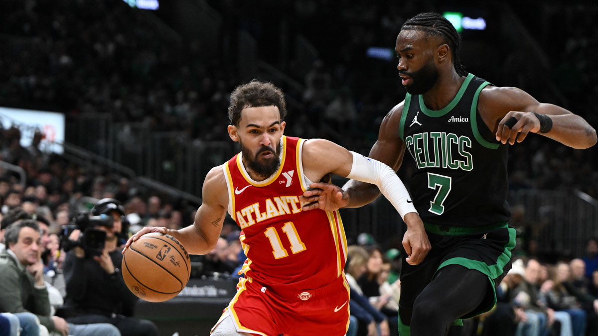 Atlanta Hawks guard Trae Young (11) drives to the basket against Boston Celtics guard Jaylen Brown (7) during the second quarter at the TD Garden. 