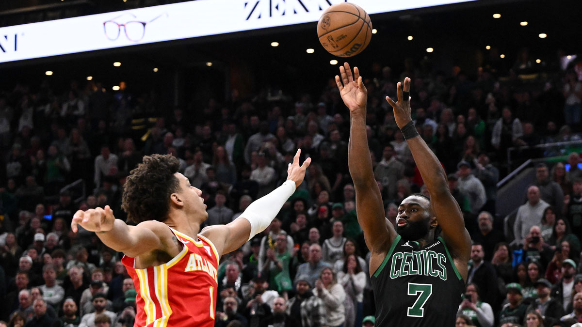 Boston Celtics guard Jaylen Brown (7) attempts a three-point basket against Atlanta Hawks forward Jalen Johnson (1) during the fourth quarter at the TD Garden. 