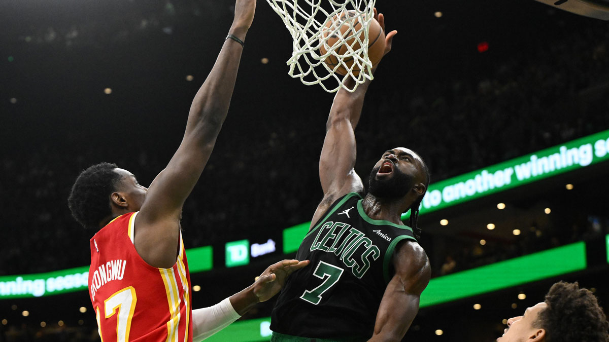 Boston Celtics guard Jaylen Brown (7) attempts a basket against the Atlanta Hawks during the fourth quarter at the TD Garden.