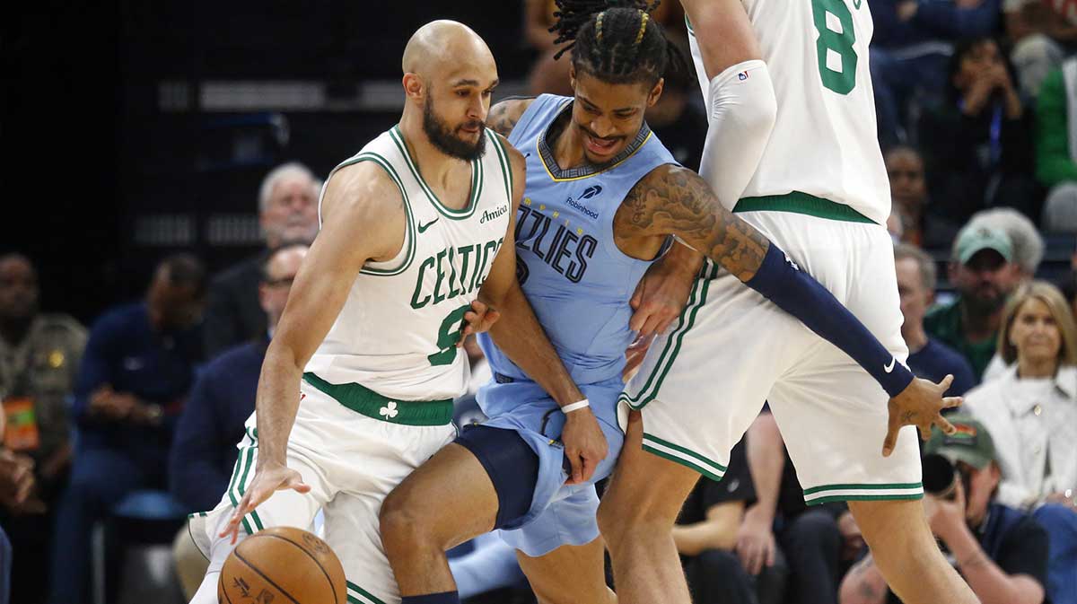 Celtics guard Derrick White (9) dribbles vs. Grizzlies' Ja Morant