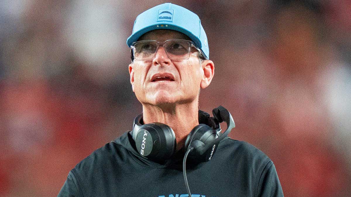 Chargers head coach Jim Harbaugh (hc) during the third quarter against the San Francisco 49ers at Levi's Stadium with Fox Sports 1's Colin Cowherd in the background