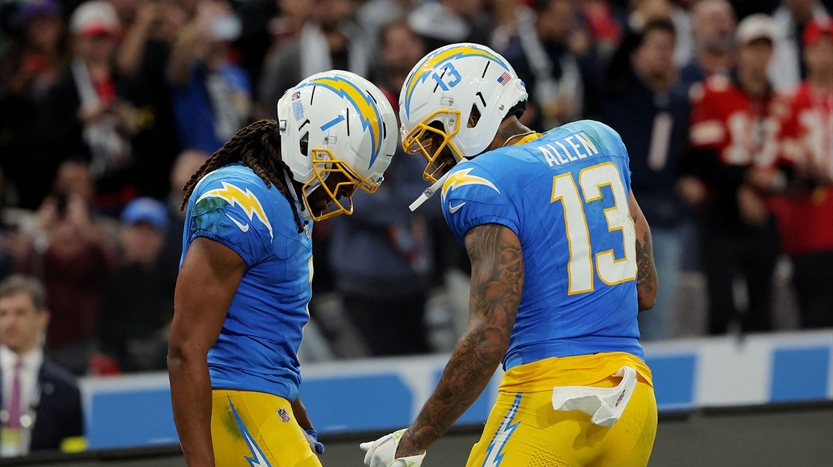 Los Angeles Chargers wide receiver Quentin Johnston (1) celebrates with wide receiver Keenan Allen (13) after scoring a touchdown against the Kansas City Chiefs in the second half during a NFL game at Corinthians Arena.