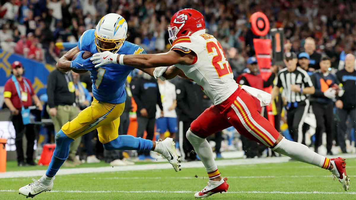 Los Angeles Chargers wide receiver Quentin Johnston (1) runs against Kansas City Chiefs safety Jaden Hicks (21) before scoring a touchdown in the second half during a NFL game at Corinthians Arena.