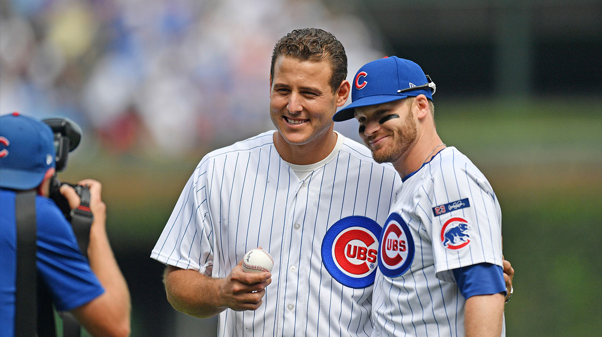 Anthony Rizzo former Chicago Cubs player and team ambassador takes a photo with left fielder Ian Happ (8) after throwing out a ceremonial first pitch prior to a game against the Tampa Bay Rays at Wrigley Field.