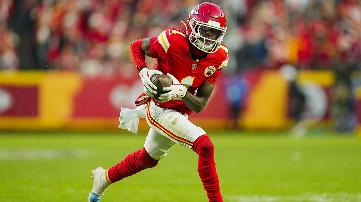 Kansas City Chiefs wide receiver Xavier Worthy (1) runs with the ball during the second half against the Las Vegas Raiders at GEHA Field at Arrowhead Stadium.