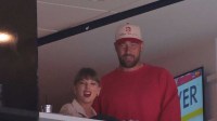 Taylor Swift and Kansas City Chiefs Travis Kelce are in attendance during the game between Edmonton Oilers and Florida Panthers in game four of the 2025 Stanley Cup Final at Amerant Bank Arena with The Ringer's Bill Simmons in the background
