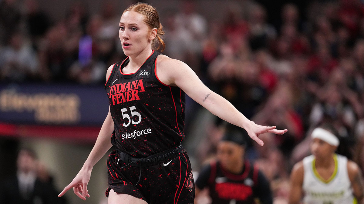 Indiana Fever forward Chloe Bibby (55) rushes up the court after scoring a three point basket.