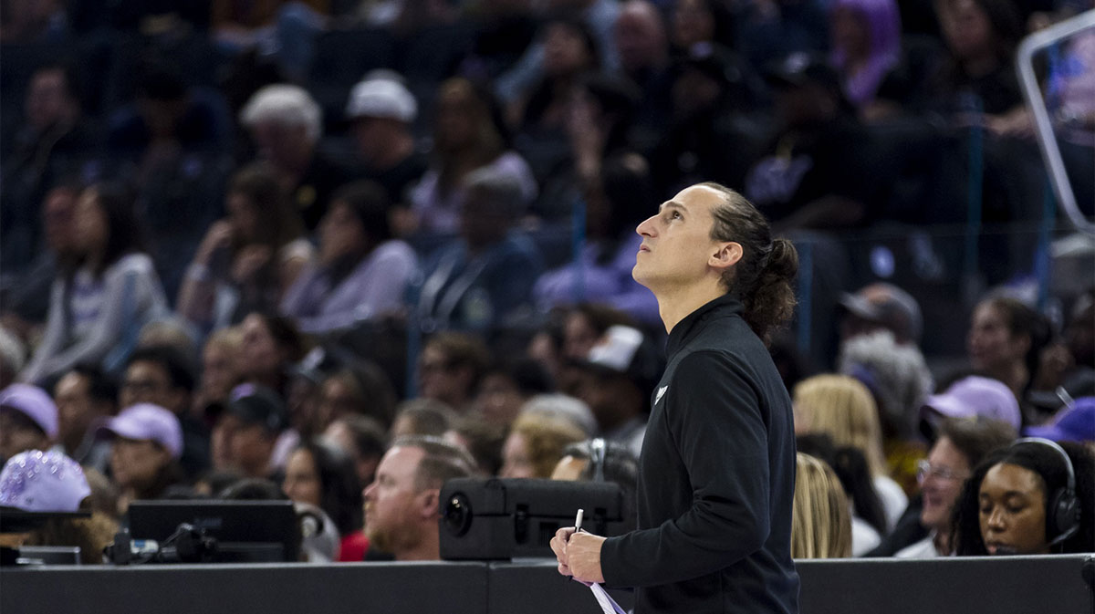 Dallas Wings head coach Chris Koclanes watches a replay during the second quarter against the Golden State Valkyries at Chase Center.