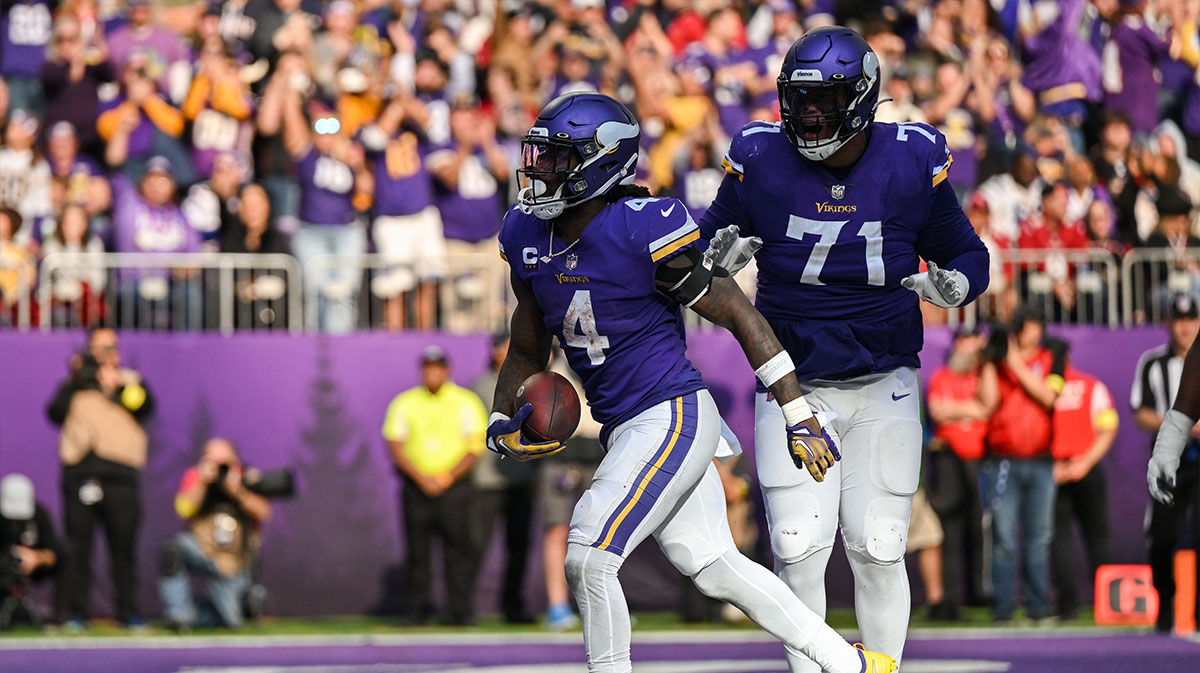 Minnesota Vikings running back Dalvin Cook (4) and offensive tackle Christian Darrisaw (71) react after a touchdown against the Arizona Cardinals during the fourth quarter at U.S. Bank Stadium.