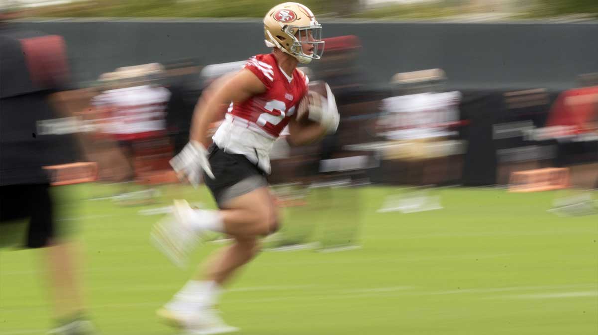 San Francisco 49ers running back Christian McCaffrey (23) runs a play from scrimmage during the second day of training camp.