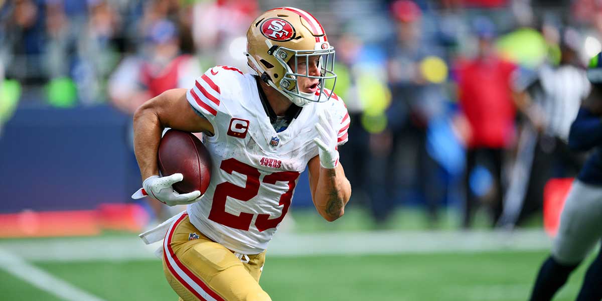 San Francisco 49ers running back Christian McCaffrey (23) runs the ball during the first half against the Seattle Seahawks at Lumen Field.