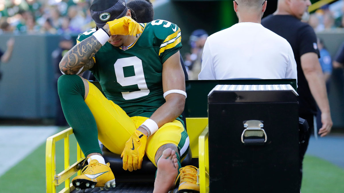 Green Bay Packers wide receiver Christian Watson (9) is carted off the field after getting injured during their football game against the Minnesota Vikings Sunday, September 29, 2024, at Lambeau Field in Green Bay, Wisconsin.