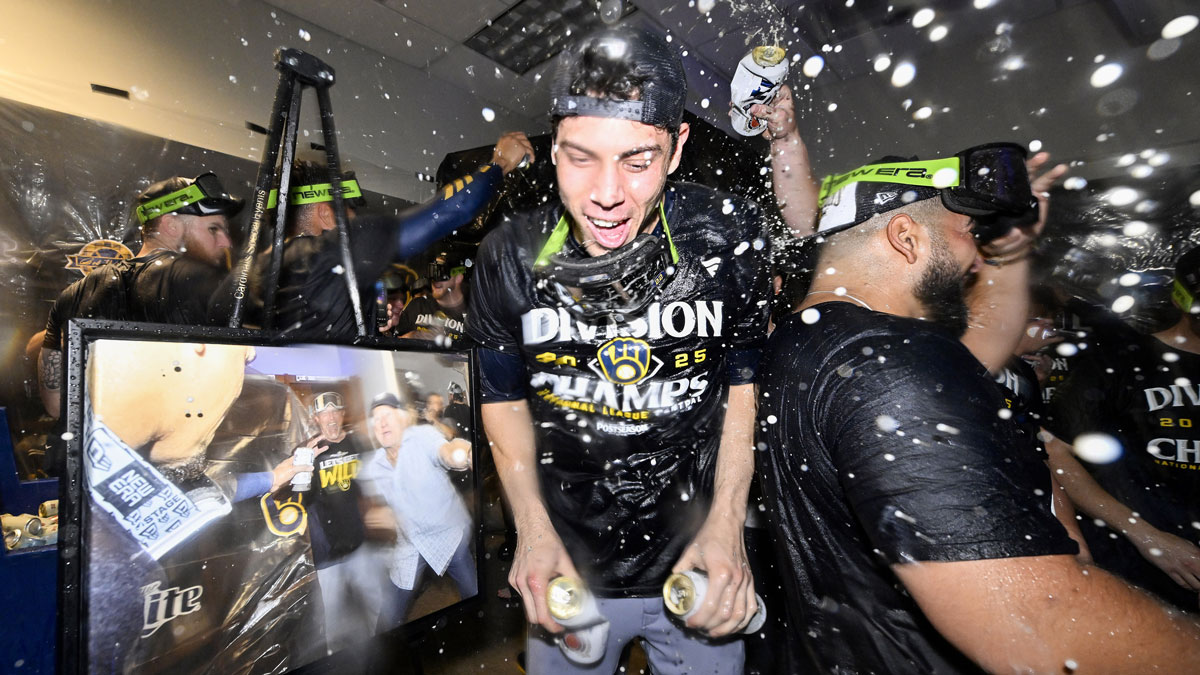 Milwaukee Brewers left fielder Christian Yelich (22) is showered with beer and champagne after the Brewers clinched the 2025 National League Central Division Championship following a game against the St. Louis Cardinals at Busch Stadium
