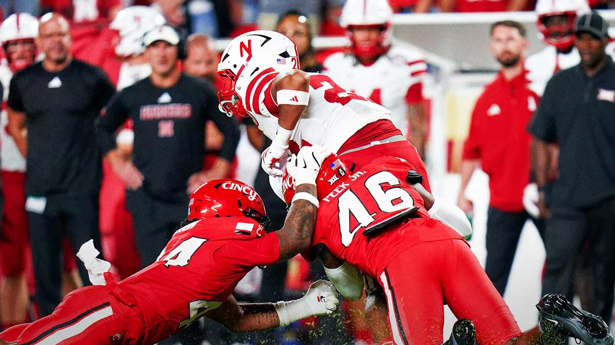 Cincinnati Bearcats defensive back Antwan Peek Jr. (46) tackles Nebraska Cornhuskers running back Isaiah Mozee (22) in the second quarter of a NCAA college football season opening game between the Cincinnati Bearcats and Nebraska Cornhuskers, Aug. 28, 2025, at Arrowhead Stadium in Kansas City, Mo.