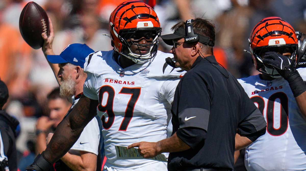 Cincinnati Bengals defensive end Shemar Stewart (97) talks with defensive coordinator Al Golden in the fourth quarter of the NFL Week 1 game between the Cleveland Browns and the Cincinnati Bengals at Huntington Bank Field in Cleveland on Sunday, Sept. 7, 2025. The Bengals begin the season with a 17-16 win over the Browns.