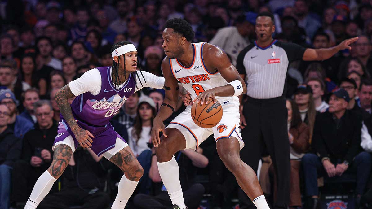 New York Knicks forward OG Anunoby (8) is guarded by Utah Jazz guard Jordan Clarkson (00) during the first half at Madison Square Garden.