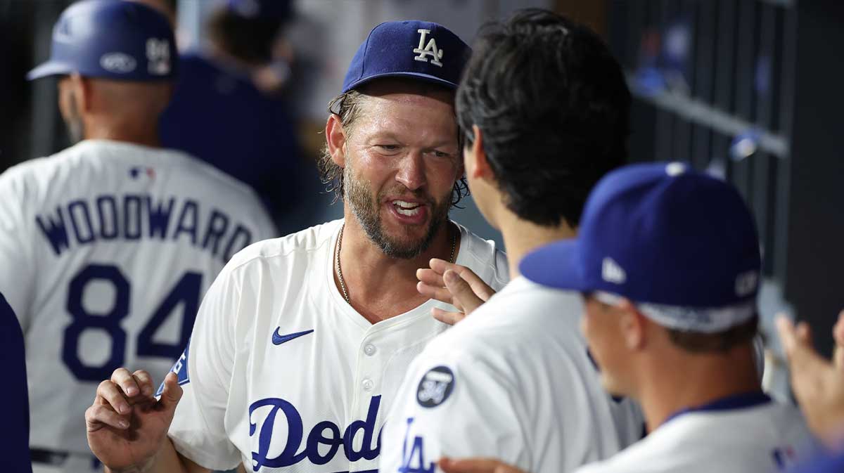 Los Angeles Dodgers pitcher Clayton Kershaw (22) is greeted by designated hitter Shohei Ohtani (17) after being relieved during the fifth inning against the San Francisco Giants at Dodger Stadium.