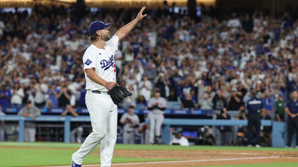 Los Angeles Dodgers pitcher Clayton Kershaw (22) salutes the crowd after being relieved during the fifth inning against the San Francisco Giants at Dodger Stadium.