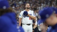 Los Angeles Dodgers pitcher Clayton Kershaw (22) salutes the crowd after being relieved during the fifth inning against the San Francisco Giants at Dodger Stadium.