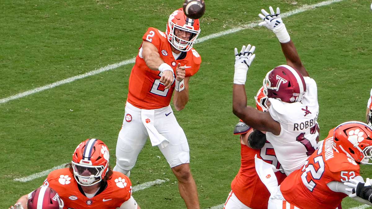 Clemson quarterback Cade Klubnik (2) passes near Troy Trojans defense during the first quarter at Memorial Stadium in Clemson, S.C. Saturday, September 6, 2025.