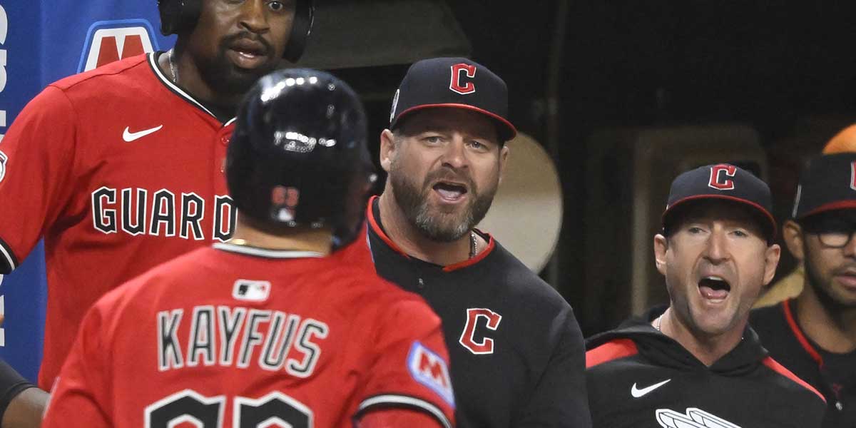 Cleveland Guardians right fielder CJ Kayfus (63) is greeted by manager Stephen Vogt (12) after hitting a two-run home run in the eighth inning against the Kansas City Royals at Progressive Field.