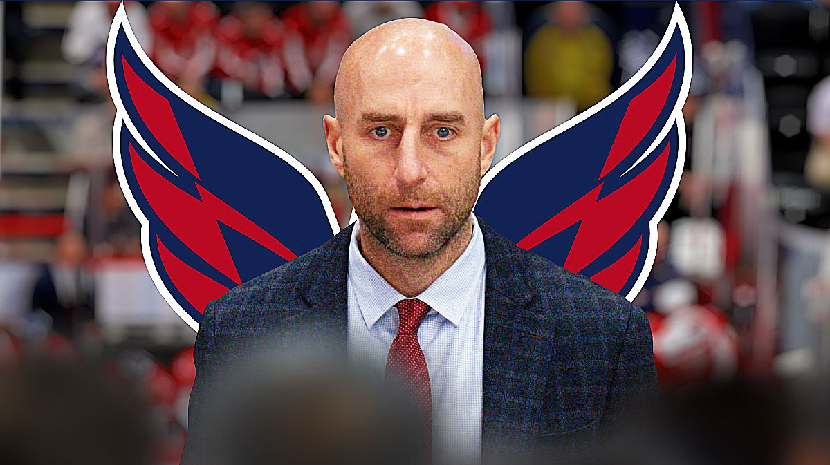 Mitch Love (assistant Coach) with the Caps logo in the background
