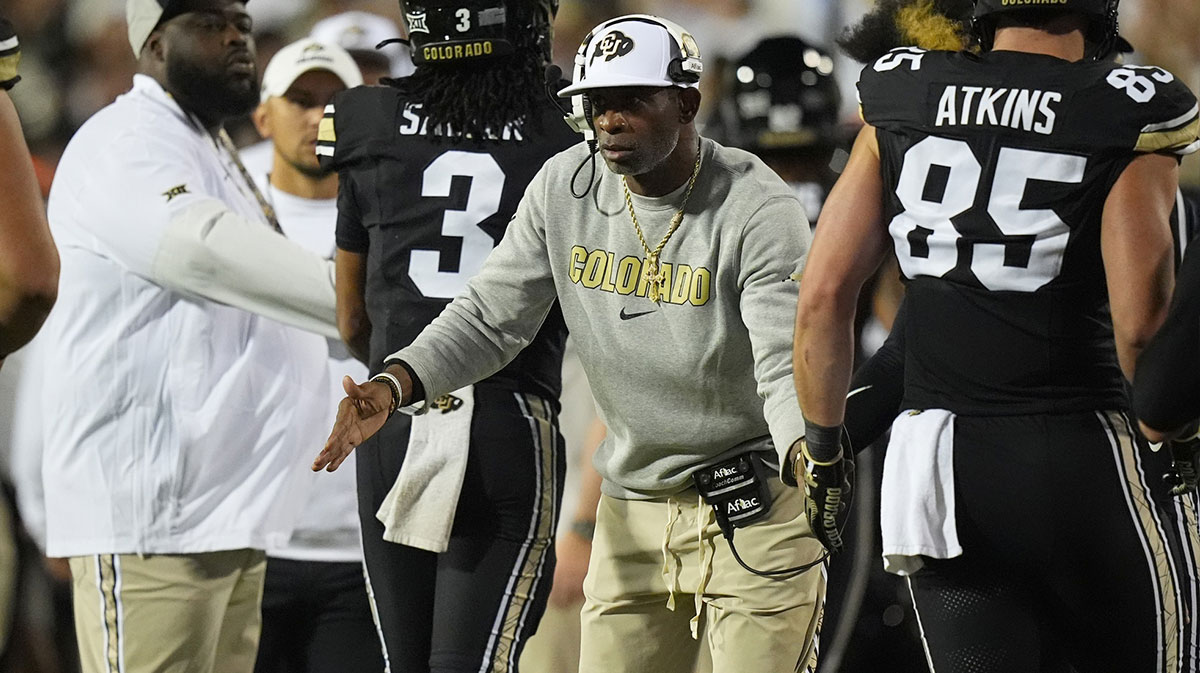 Colorado Buffaloes head coach Deion Sanders celebrates a touchdown with his players in the fourth quarter against the Wyoming Cowboys at Folsom Field.