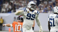 Indianapolis Colts defensive tackle DeForest Buckner (99) celebrates a tackle against Denver Broncos quarterback Bo Nix (10) during the fourth quarter at Lucas Oil Stadium.