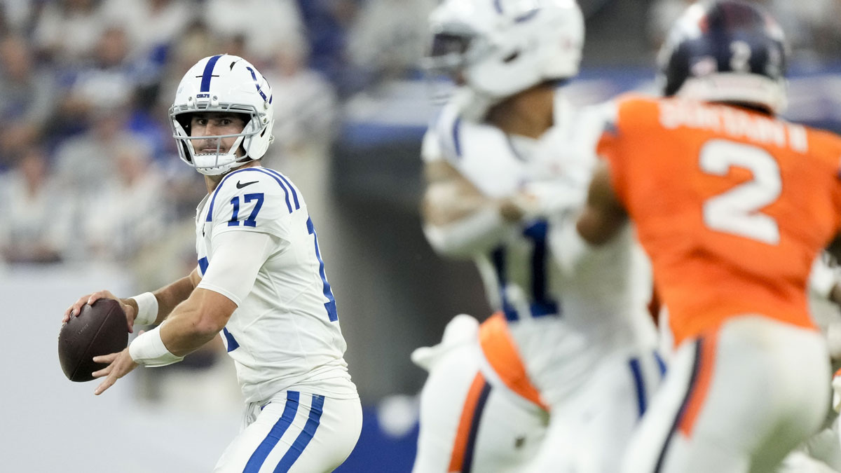 Indianapolis Colts quarterback Daniel Jones (17) looks to pass downfield against the Denver Broncos at Lucas Oil Stadium.