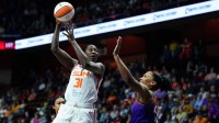 Connecticut Sun center Tina Charles (31) shoots against Phoenix Mercury forward Alyssa Thomas (25) in the first half.