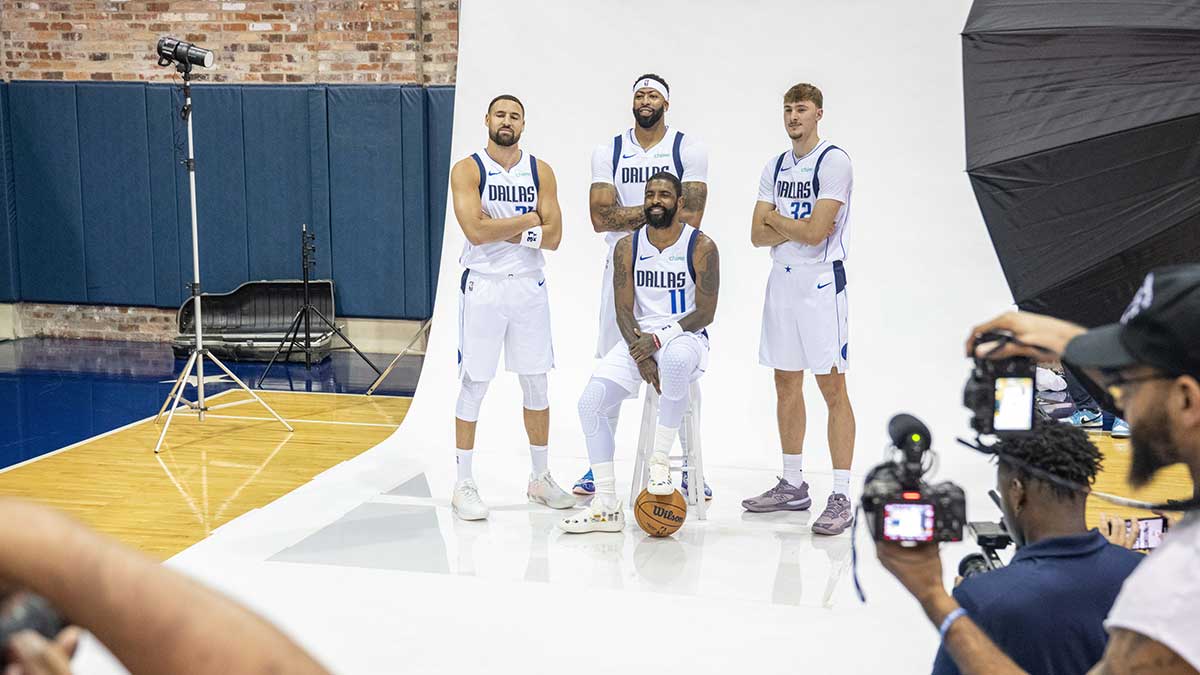 Dallas Mavericks forward Anthony Davis (3) and guard Kyrie Irving (11) and forward Cooper Flagg (32) and guard Klay Thompson (31) pose for a photo during the Mavericks 2025 media day at the American Airlines Center.